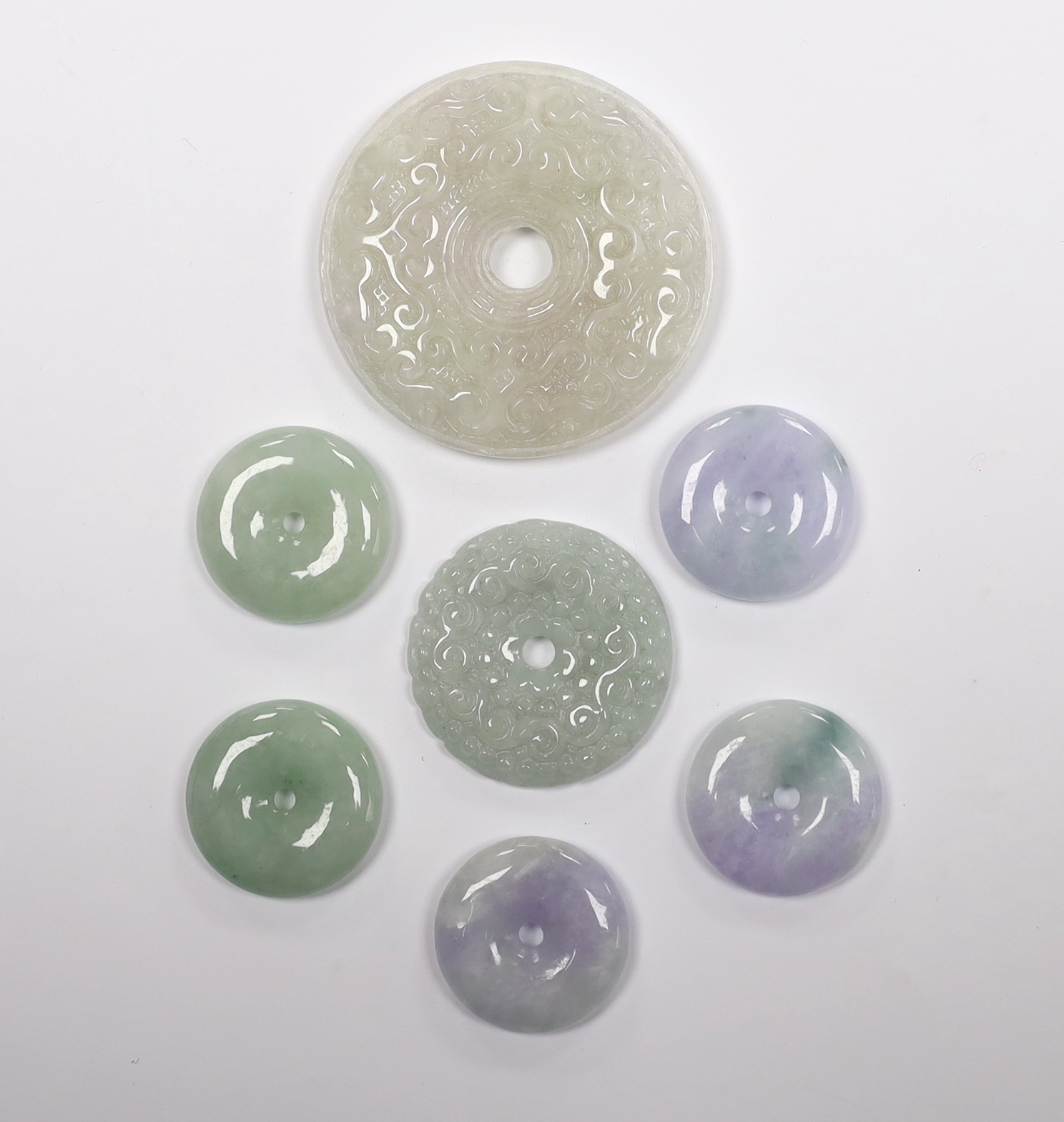 Seven Chinese carved jadeite bi discs